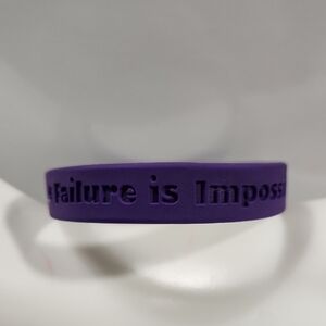 Purple Silicone Awareness Bracelet with the Debossed text Failure is Impossible